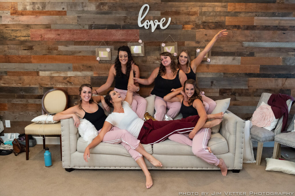 Bride and bridesmaids relaxing together in the Deer Park Villa Bridal Cottage before the ceremony